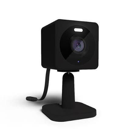 Compact smart cube security camera on a desk stand