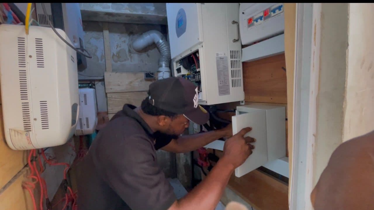 NMC technician wiring a control panel