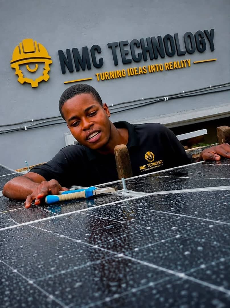 NMC Technology technician installing a solar panel